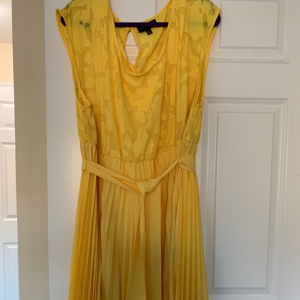 Yellow dress with pleated skirt